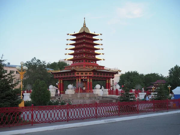 Elista, Republic of Kalmykia, Russia - June, 2019: Pagoda Seven Days, Elista, Kalmykia, Russia with Buddhist prayer wheel with mantra sounds Om mani padme hum . — Stock Photo, Image