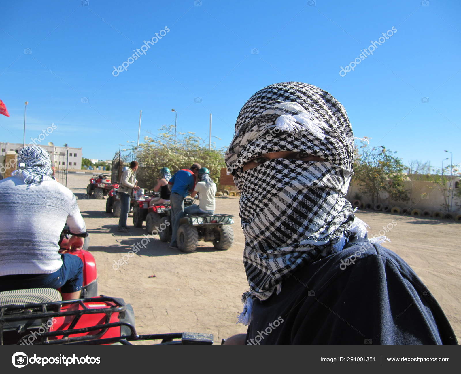 Arafat. The Palestinian keffiyeh is a gender-neutral checkered black and  white scarf that is usually worn around the neck or head. Stock Photo by  ©yulek1985 291001354