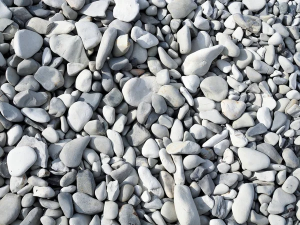 Yuvarlak işlenebilir taşlarla soyut arkaplan.