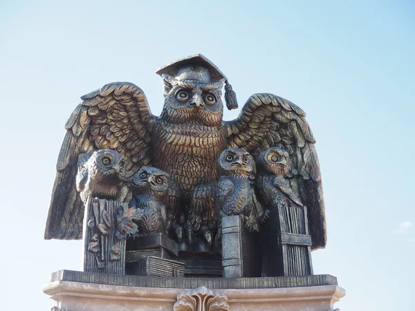 Symbol of wisdom and knowledge owl with owls. Sculpture on the Balashov embankment.