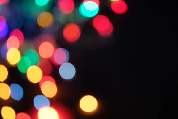 Desfocado abstrato multicolorido bokeh luzes fundo. Magic explosão estrela com partículas — Fotografia de Stock