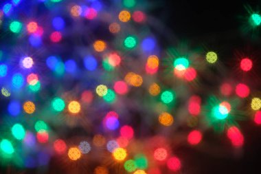 Ufuk soyut çok renkli bokeh arka plan ışıklar. Sihirli patlama star parçacıkları ile