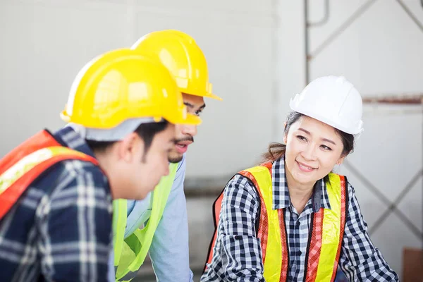 engineer discuss in meeting with relax, happy and smile feeling at site work on construction building