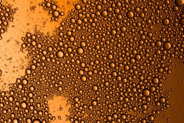 Sarı turuncu su damlaları arka plan.