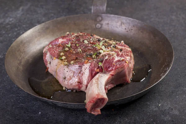 beautifully seared tomahawk steak, medium rare to rare