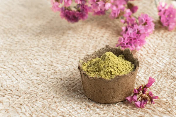 henna powder for dyeing hair, eyebrows and mehendi on a burlap made of natural material