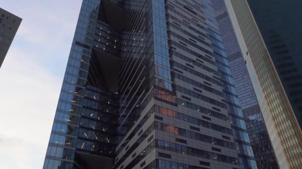 Panoramic view of skyscrapers. Movement of the frame from the bottom up and back — Stock Video