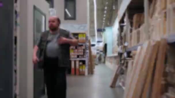 Time Lapse. POV. Movement on the hardware store between the shelves and sections — Stock Video