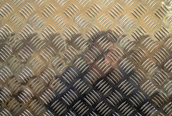 Metal floor plate, with diamond pattern