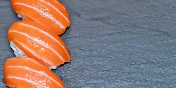 Rainbow Sushi Roll with salmon, eel, tuna, avocado, royal prawn, cream cheese Philadelphia, caviar tobica, chuka. Sushi menu. Japanese food. — Stock Photo, Image