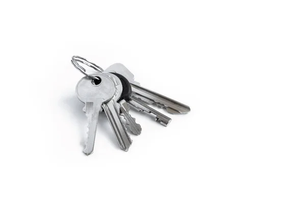 Several keys on a white isolated background,the keys to the apar — Stock Photo, Image