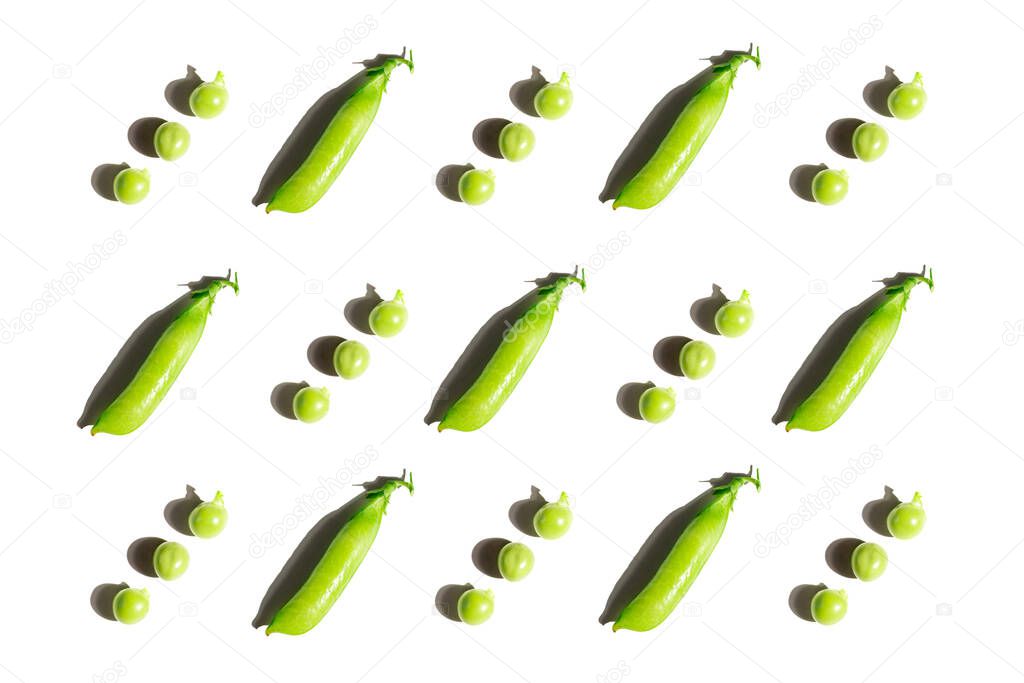 Pattern from pods of green peas with shadow on white isolated background. Fresh vegetables, vitamins. Healthy food concept. Several peas are kept separately. Flat lay. 