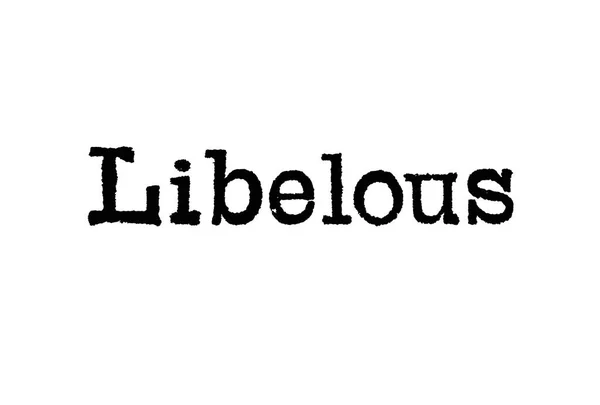 白い背景の上タイプライターから単語 Libelous — ストック写真