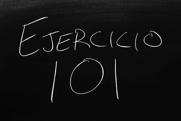The words Ejercicio 101 on a blackboard in chalk.  Translation: Exercise 101