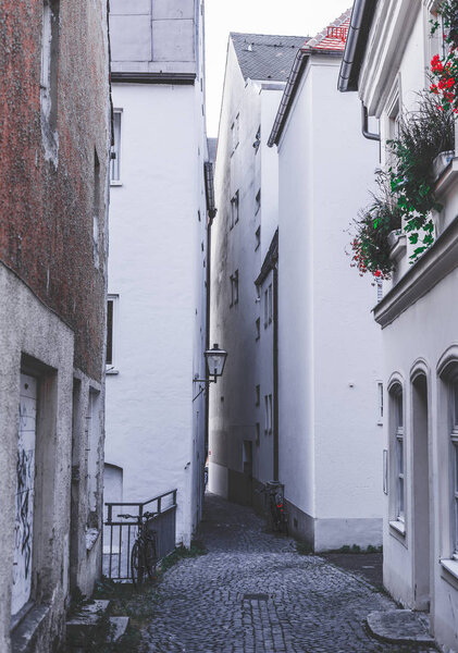 Narrow alley between many houses
