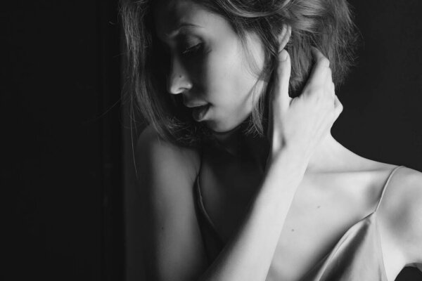 Portrait of a beautiful, sexy women. Black and white art photo. The concept of beauty and youth