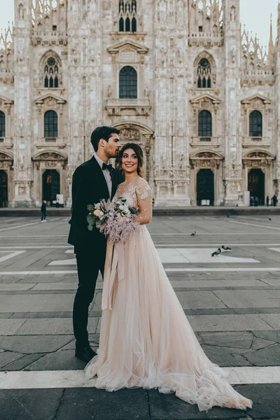 Bride and groom at Italian wedding in middle of Milan, Italy
