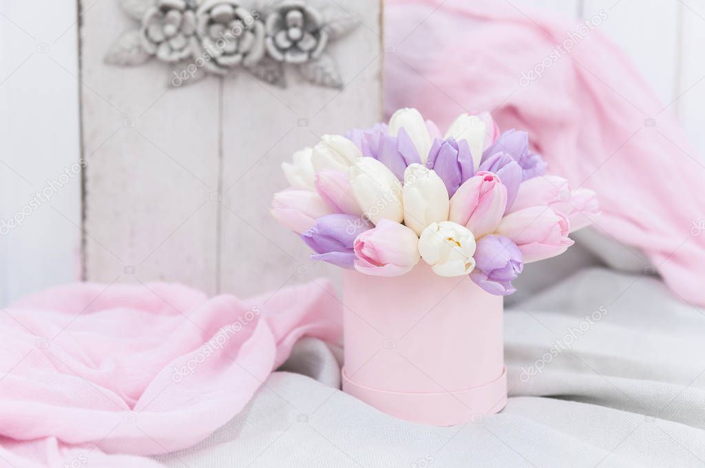 Beautiful Bouquet of flowers in a round hat box on a table