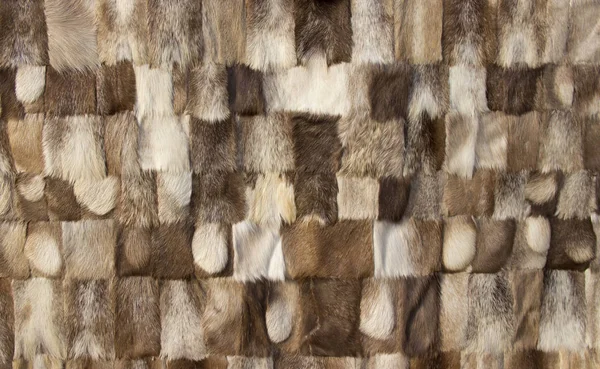 Stitched together pieces of animal fur.