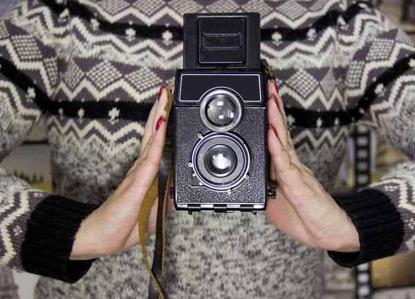 vintage camera in the hands of a girl