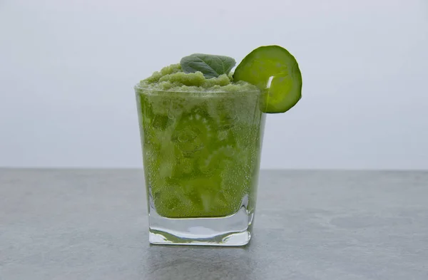 Nutritious celery cocktail for weight loss and maintaining a healthy lifestyle. In cocktail added cucumber and green leaf. — Stock Photo, Image