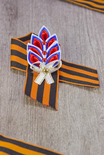 St. George ribbon victory symbol on wooden background