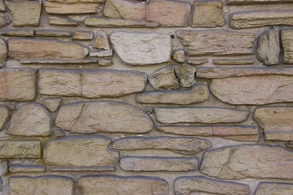 La pared de piedra natural en luz natural — Foto de Stock