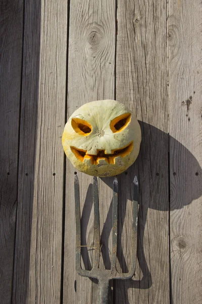 Halloween pumpkin  jack lantern on a pitchfork — Stock Photo, Image