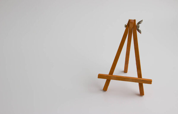 wooden stand for pictures and photos on a light background