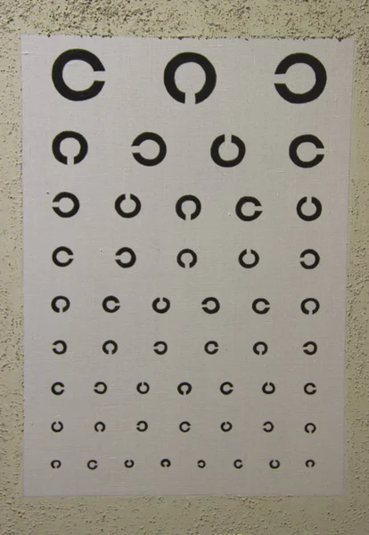 table to check visual acuity hanging on the wall