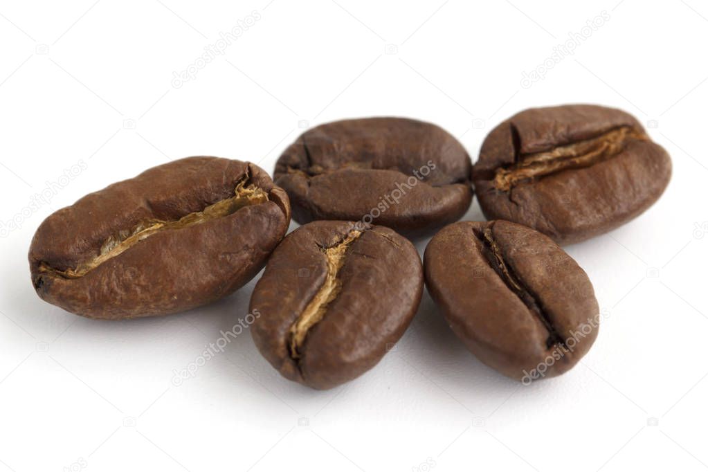 closeup of coffee beans isolated on white background.