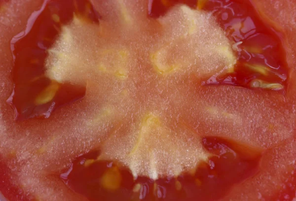 Achtergrond van sappige tomaat, de kern van rijpe groente — Stockfoto