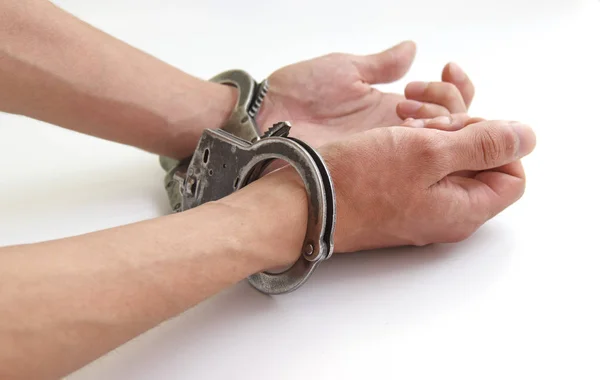 Prisoner with his hands chained isolated on white background — Stock Photo, Image