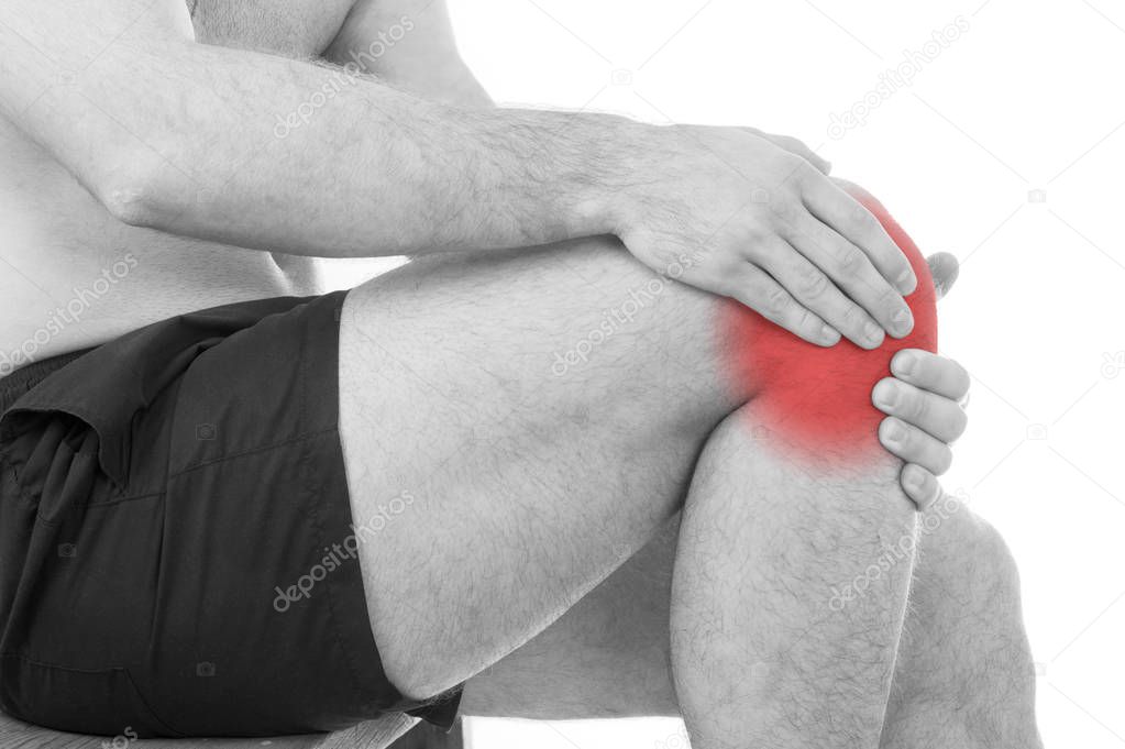 Man with knee pain over white background