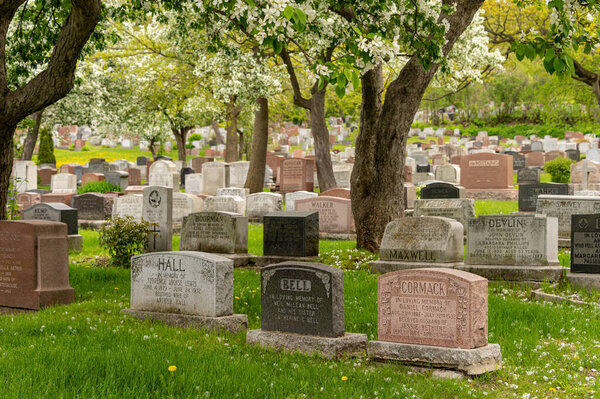 Montreal, CA - 30 May 2019: Headstones in Montreal cemetery in the Springtime