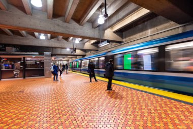 Montreal, CA - 15 October 2019: Subway train arriving at Lionel Groux Station. clipart