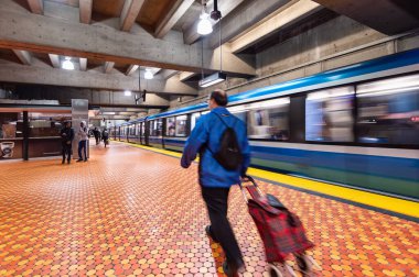 Montreal, CA - 15 October 2019: Subway train leaving Lionel Groux Station. clipart