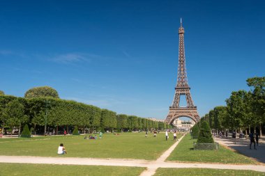 Paris, France - 23 June 2018: Eiffel Tower from the Champ de Mars gardens in summer. clipart