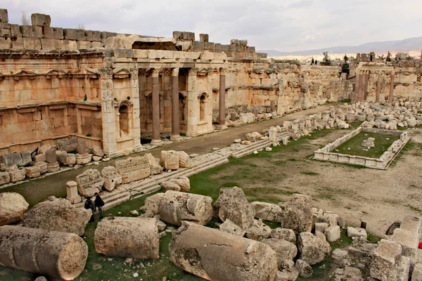 Baalbek - ruins of The Great Court of the ancient Phoenician city with range of mountains at the background