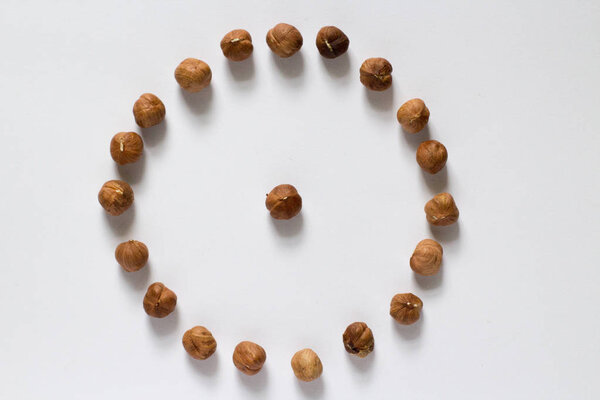 handful of nuts on a white background, almonds and hazelnuts
