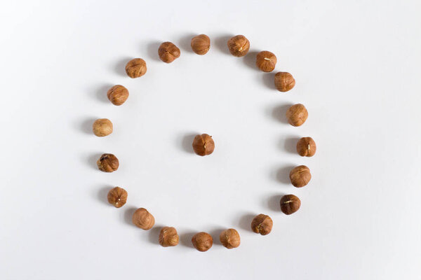 handful of nuts on a white background, almonds and hazelnuts