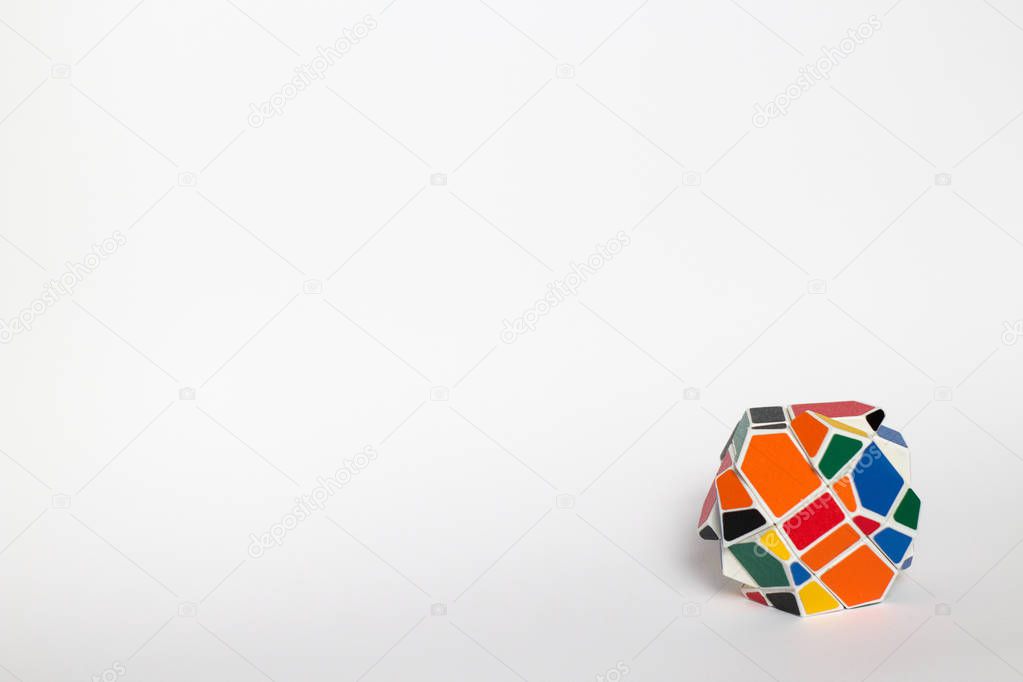 Multi-colored unusual puzzle, strange shape rubik's cube, on a white background