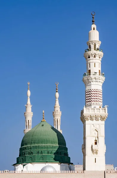 Exterior view of minarets and green dome of a mosque taken off t — Stock Photo, Image