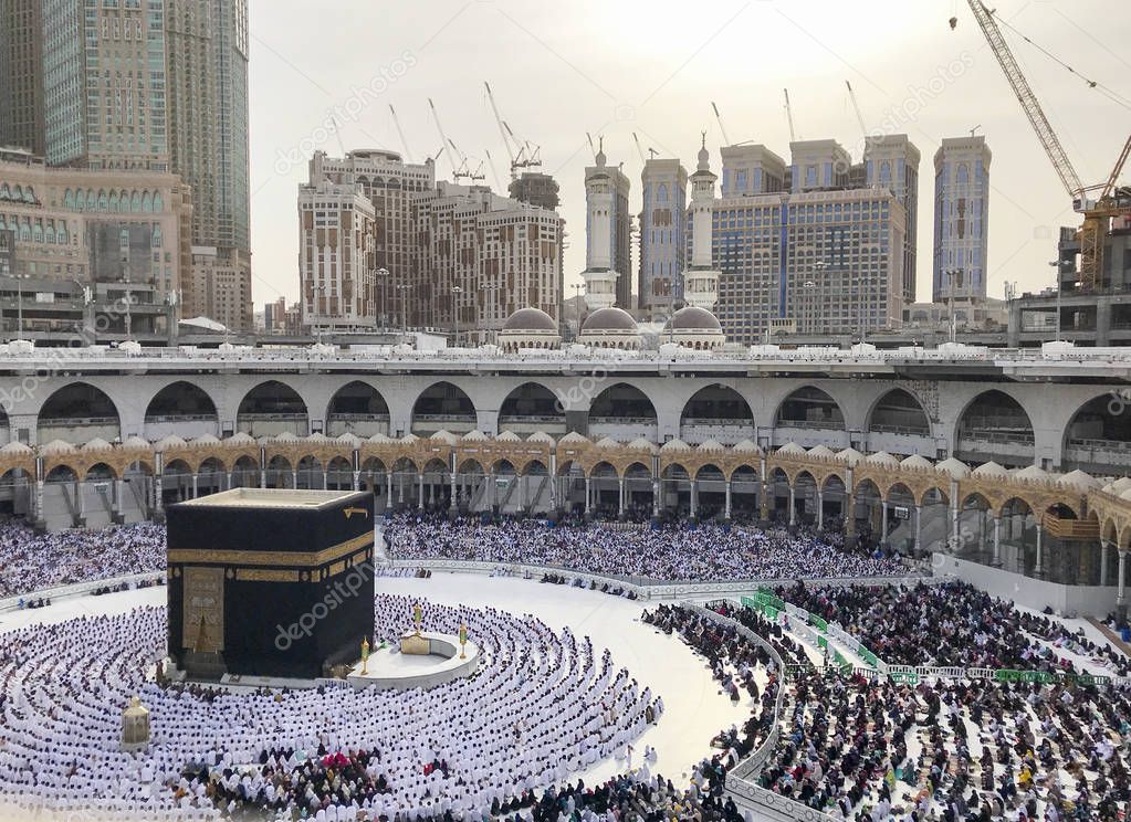 Bird's eye view of unidentified Muslim pilgrims in sitting  posi