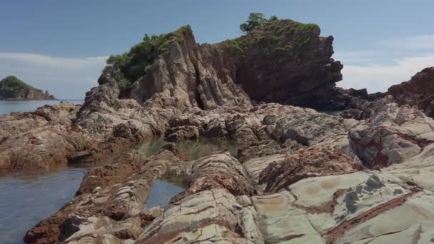 Pan Left Beautiful Tropical Sedimentary Rock Pattern Small Island Islet — Stock Video
