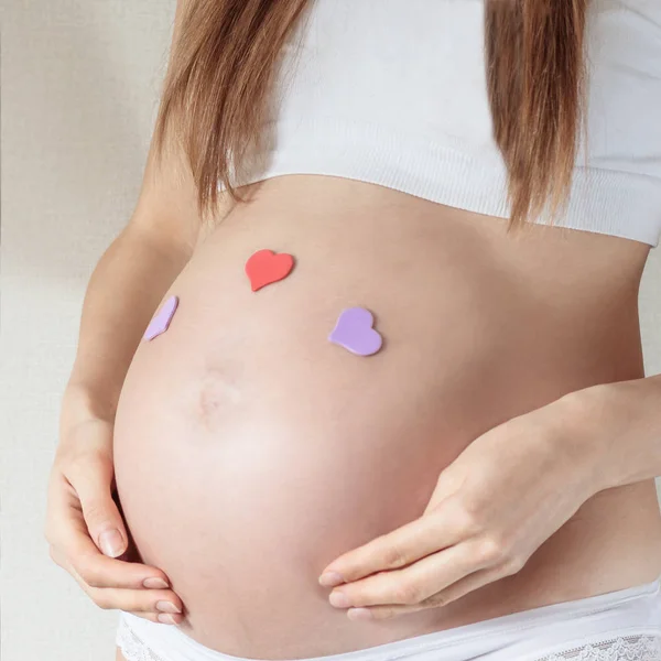 Belly Pregnant Woman Month Closeup Glued Hearts — Stock Photo, Image