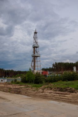 Color shot of a shale gas drilling rig on a field. clipart