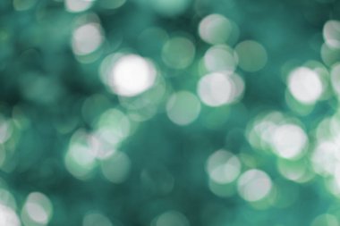 Turkuaz ve mavi bulanık bokeh ışıkları arka plan