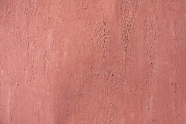 Soluk kırmızı aşınmış boya ile metal doku arka plan