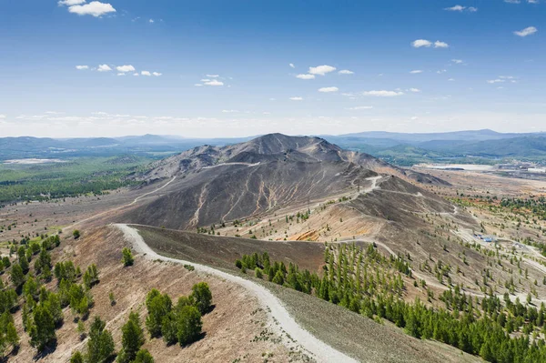 Aerial view of wasteland at Mount Karabash. Bald mountain with barren land. Pollution of natural environment by industrial production in Karabash town, Chelyabinsk Oblast, Ural, Russia